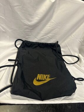 Nike Black Drawstring Backpack with Gold Swoosh